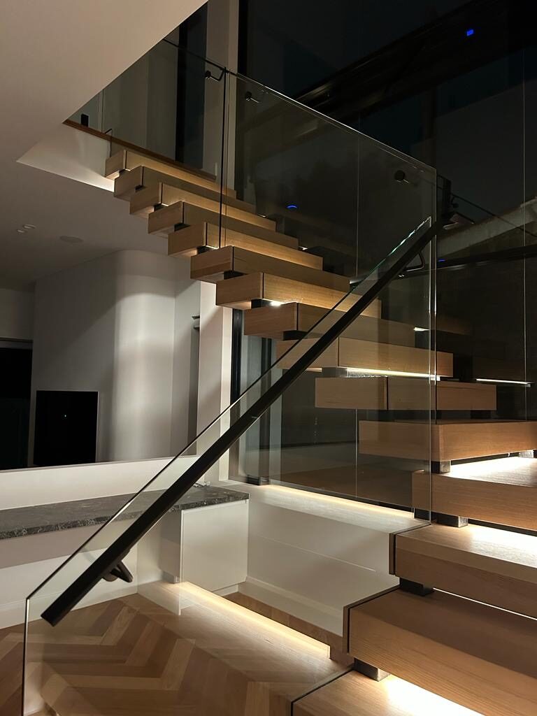 Floating staircase with LED step lighting